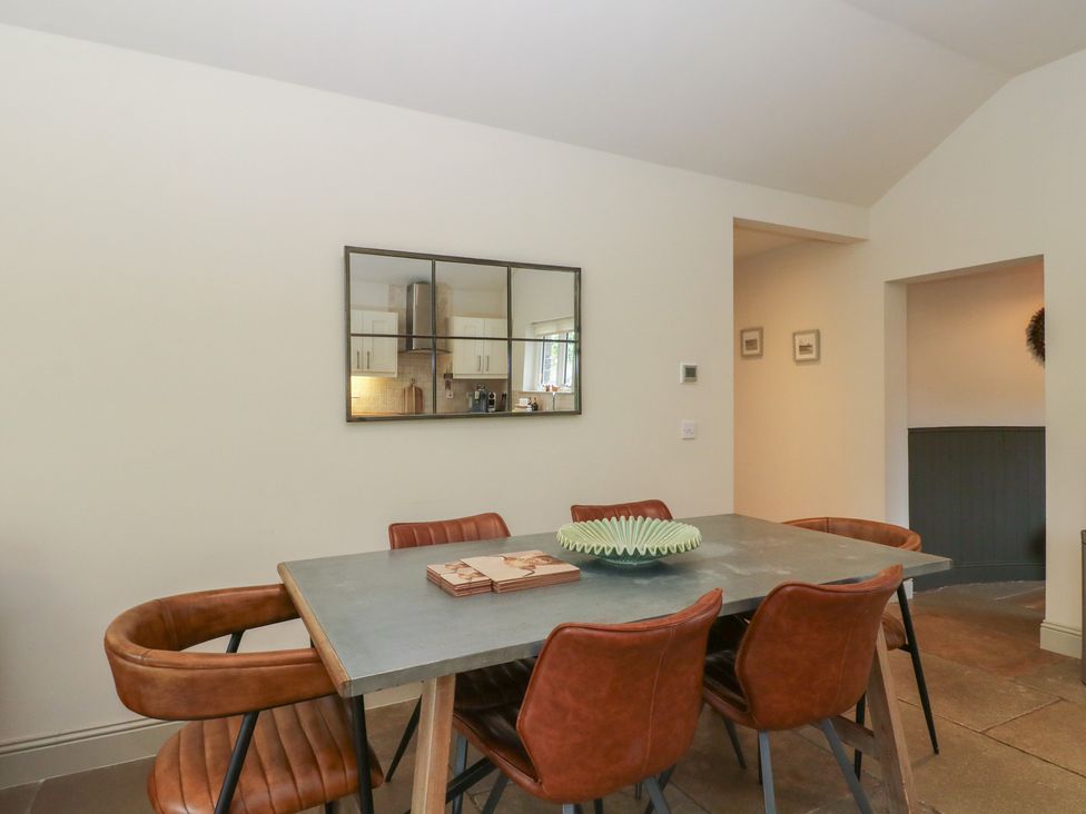 A dining room with a table and chairs at Glen Lochay Lodge in Killin
