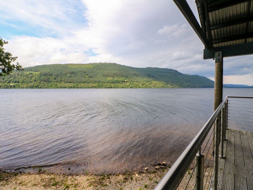 A view of a lake and mountains at Osprey Boathouse in Killin