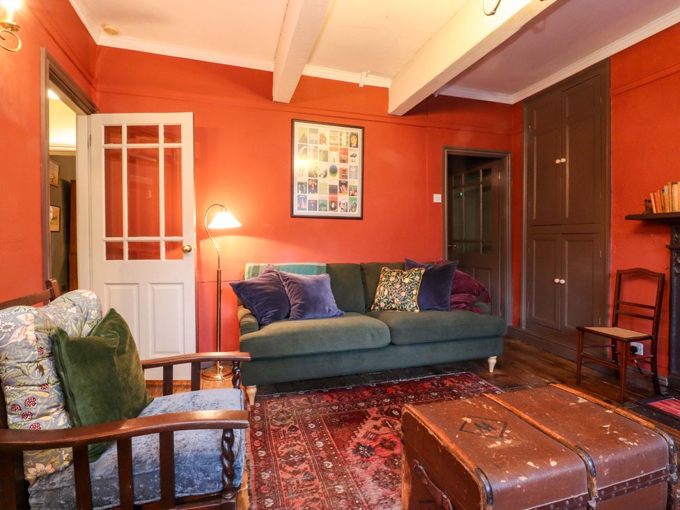 A living room with a sofa and armchair at Devonshire House in Settle