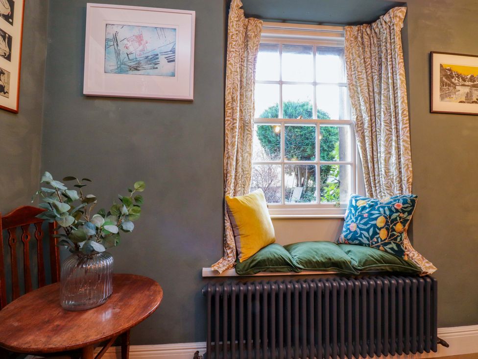 A snug with cushions on a radiator at Devonshire House in Settle