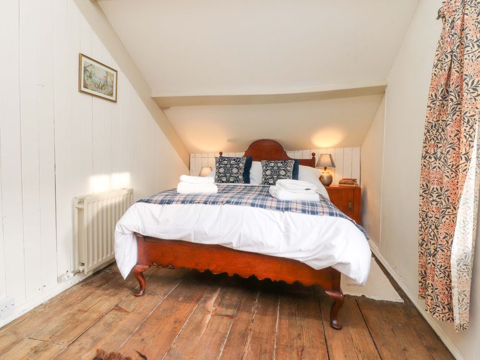 A bedroom with a bed and bedside table at Devonshire House in Settle