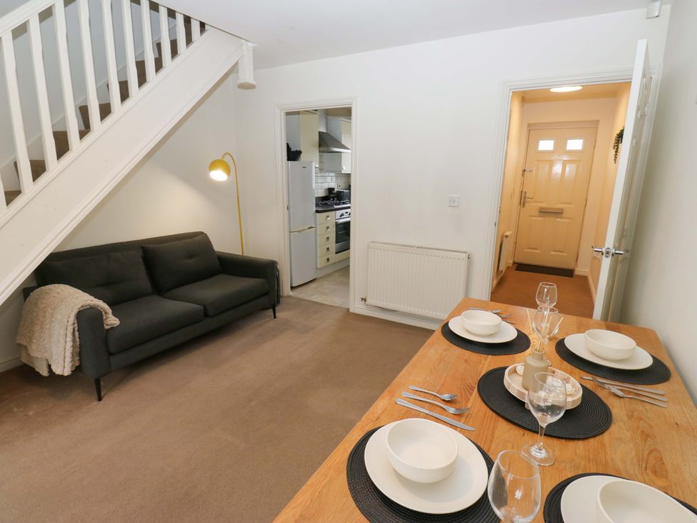 A living room with sofa and dining table at Cottage Holiday Home in Huddersfield