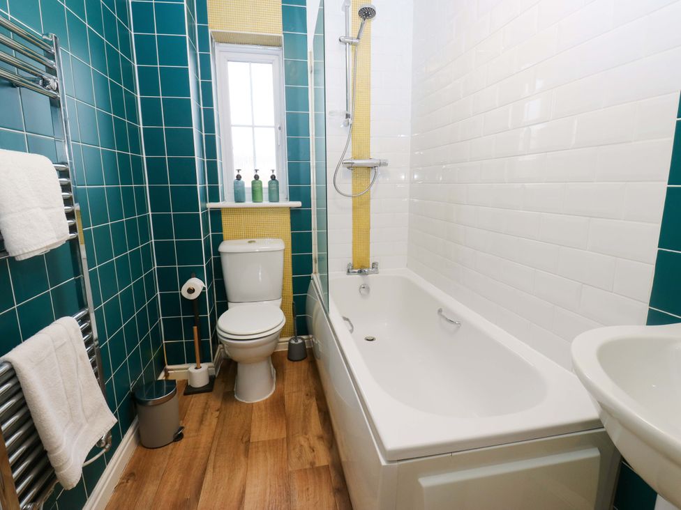 A bathroom with a bathtub and shower at Cottage Holiday Home in Huddersfield