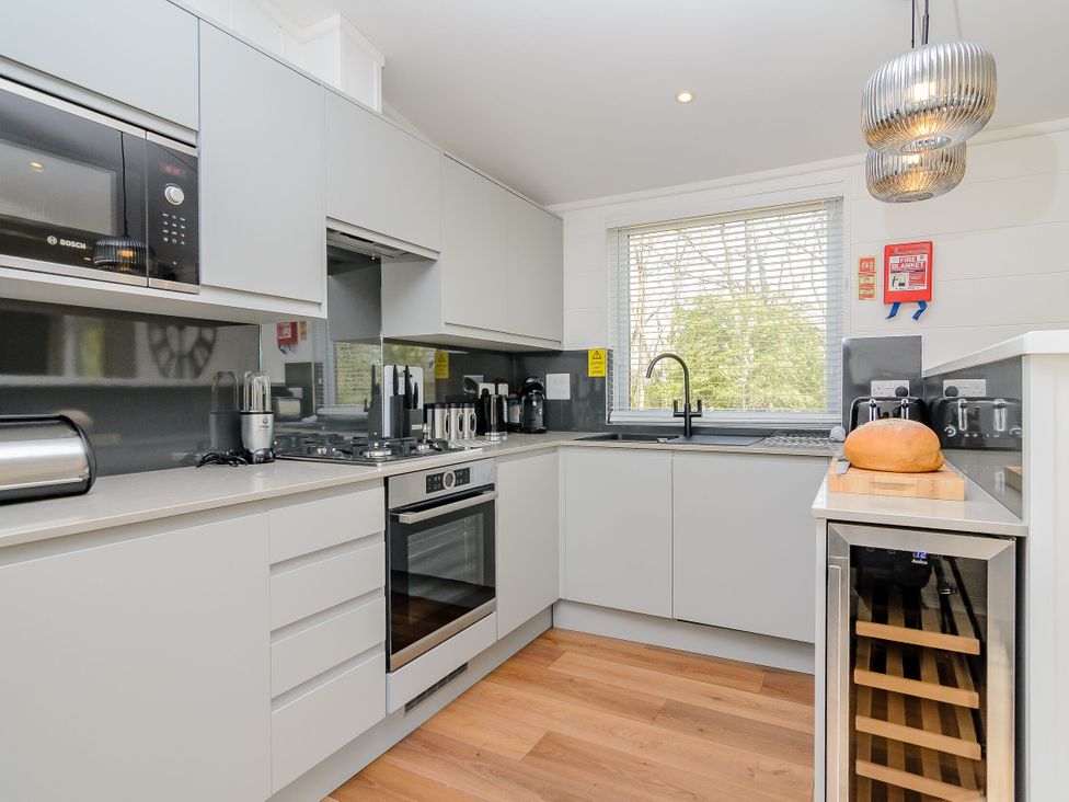 A kitchen with cabinets and appliances at The Elton in Kings Cliffe