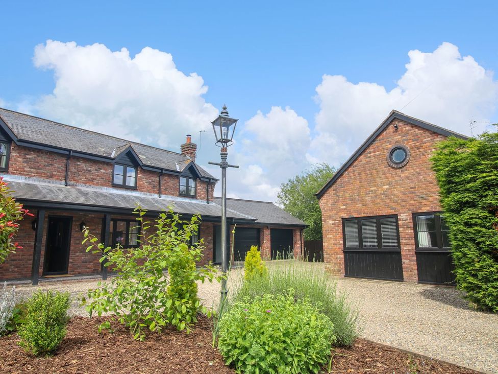 A house with a garden and driveway at 1 Clarkes Lane St Martins