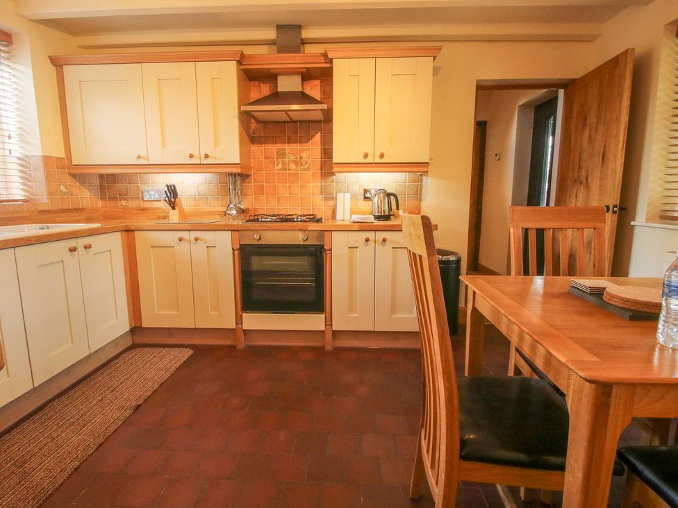 A kitchen with cabinets and appliances at 1 Clarkes Lane St Martins