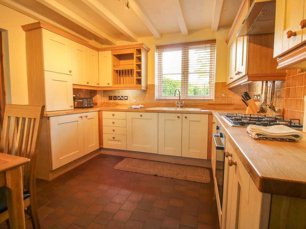 A kitchen with cabinets and appliances at 1 Clarkes Lane in St Martins
