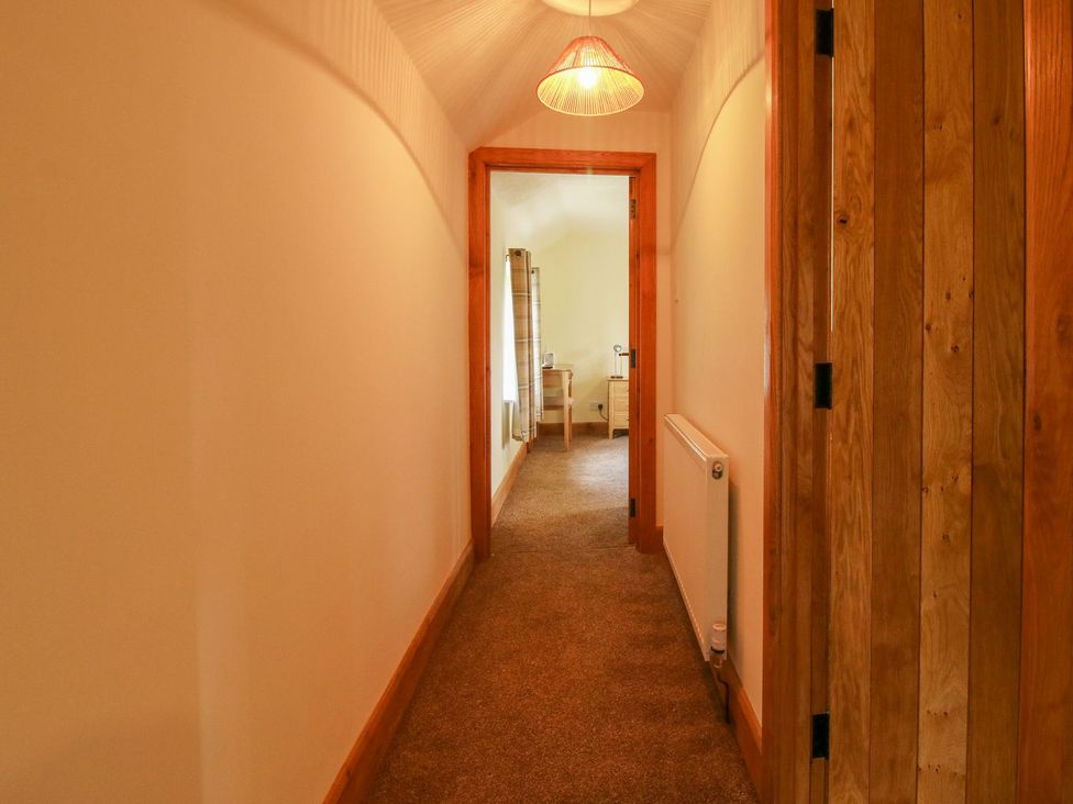 A hallway with a light fixture and a door at 1 Clarkes Lane St Martins
