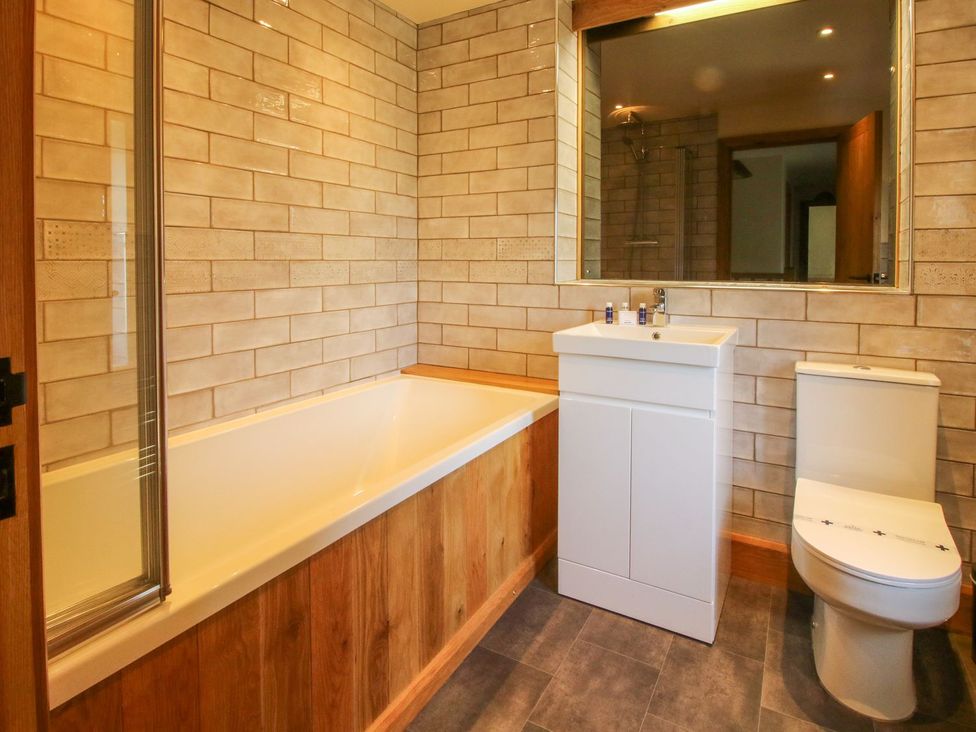 A bathroom with bathtub, sink, and toilet at 1 Clarkes Lane St Martins