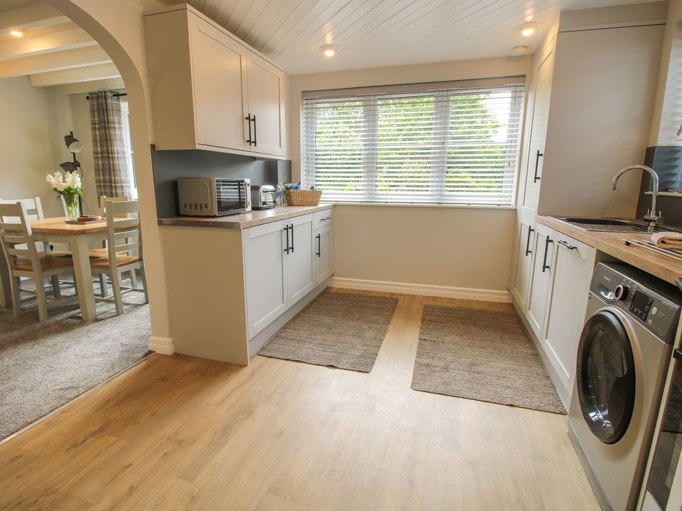 A kitchen with cabinets and appliances at 1 Clarkes Lane St Martins