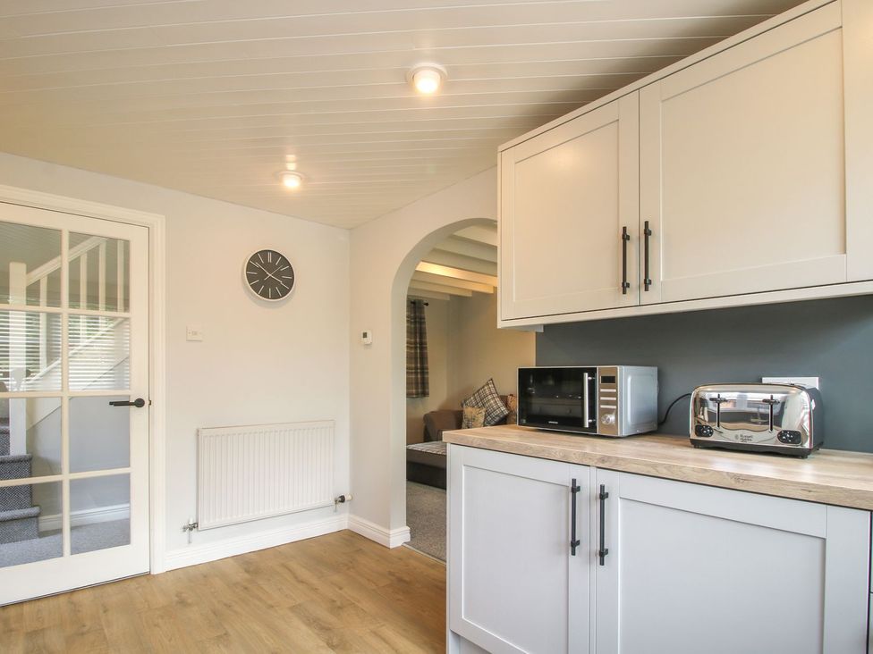 A kitchen with appliances and cabinets at 1 Clarkes Lane, St Martins