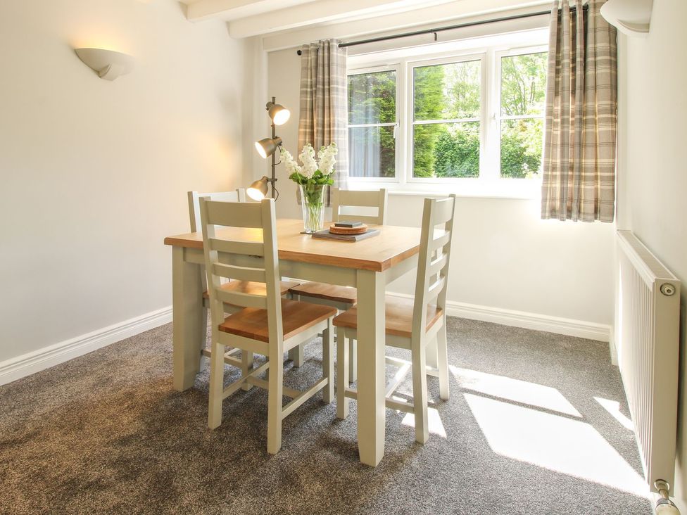 A dining room with a table and chairs at 1 Clarkes Lane St Martins