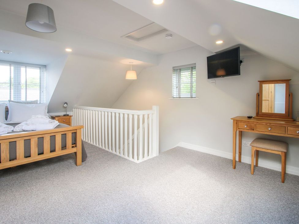 A bedroom with a bed and dresser at 1 Clarkes Lane St Martins