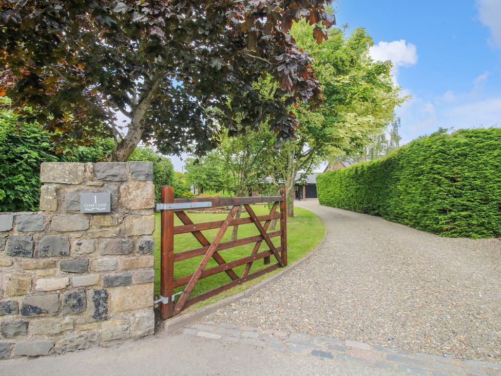 An outdoor area with a gravel driveway and gate at 1 Clarkes Lane in St Martins