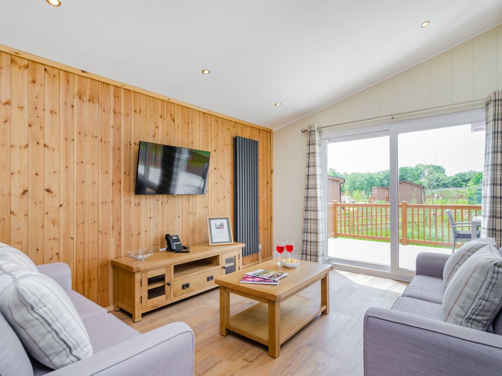 A living room with a sofa and coffee table at The Apethorpe (Pet) in Kings Cliffe