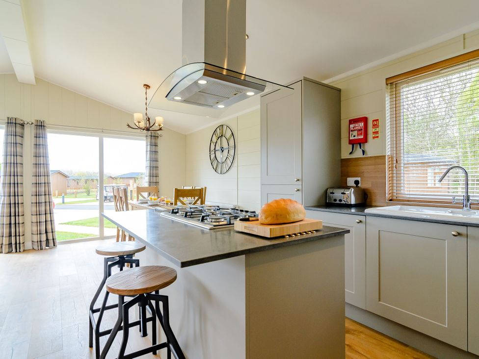 A kitchen with a stove and sink at The Yarwell (Pet) in Kings Cliffe