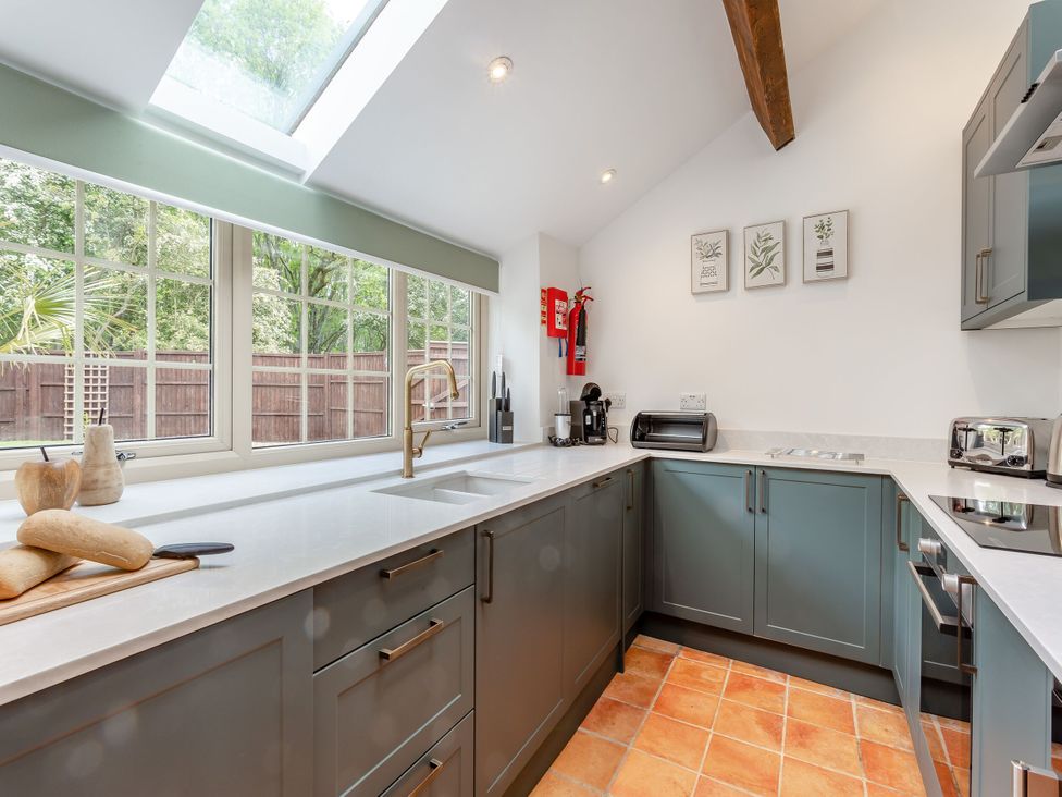 A kitchen with a sink and cabinets at The Cottage in Kings Cliffe