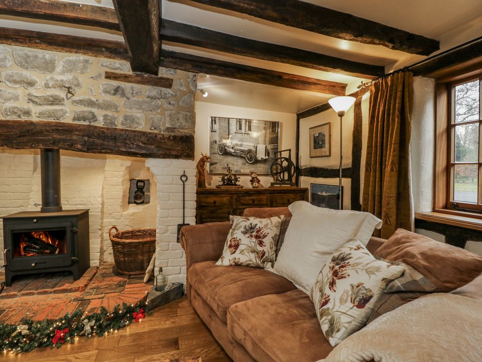 A living room with a sofa and a fireplace at 24 Eastcourt