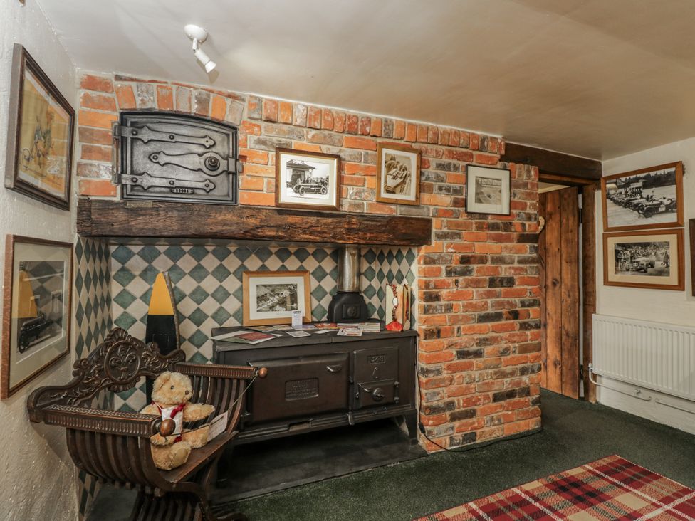 A snug with a stove and teddy bear at 24 Eastcourt