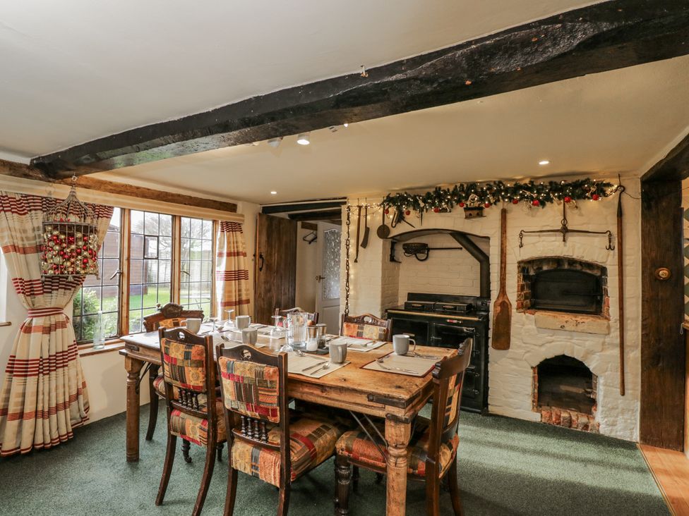A dining room with a table and chairs at 24 Eastcourt