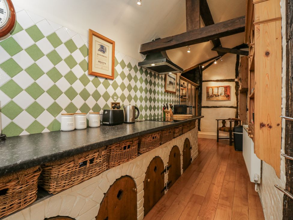 A kitchen with countertop and wall tiles at 24 Eastcourt