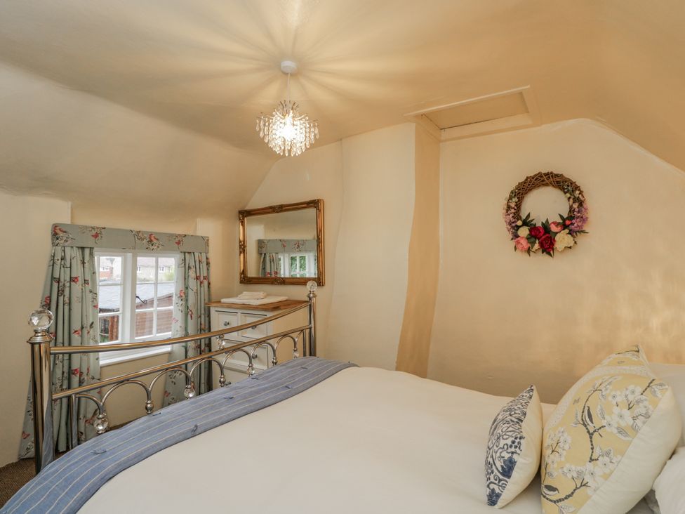 A bedroom with a bed and window at 24 Eastcourt