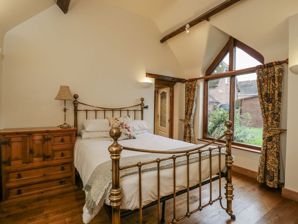 A bedroom with a bed and dresser at 24 Eastcourt
