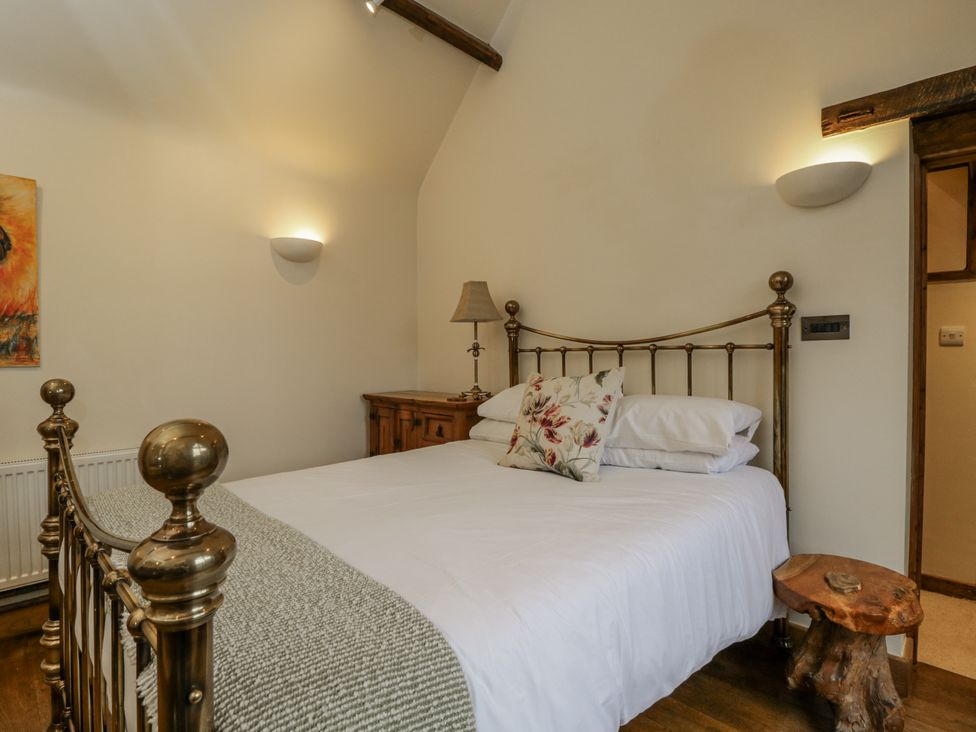 A bedroom with a bed and dresser at 24 Eastcourt