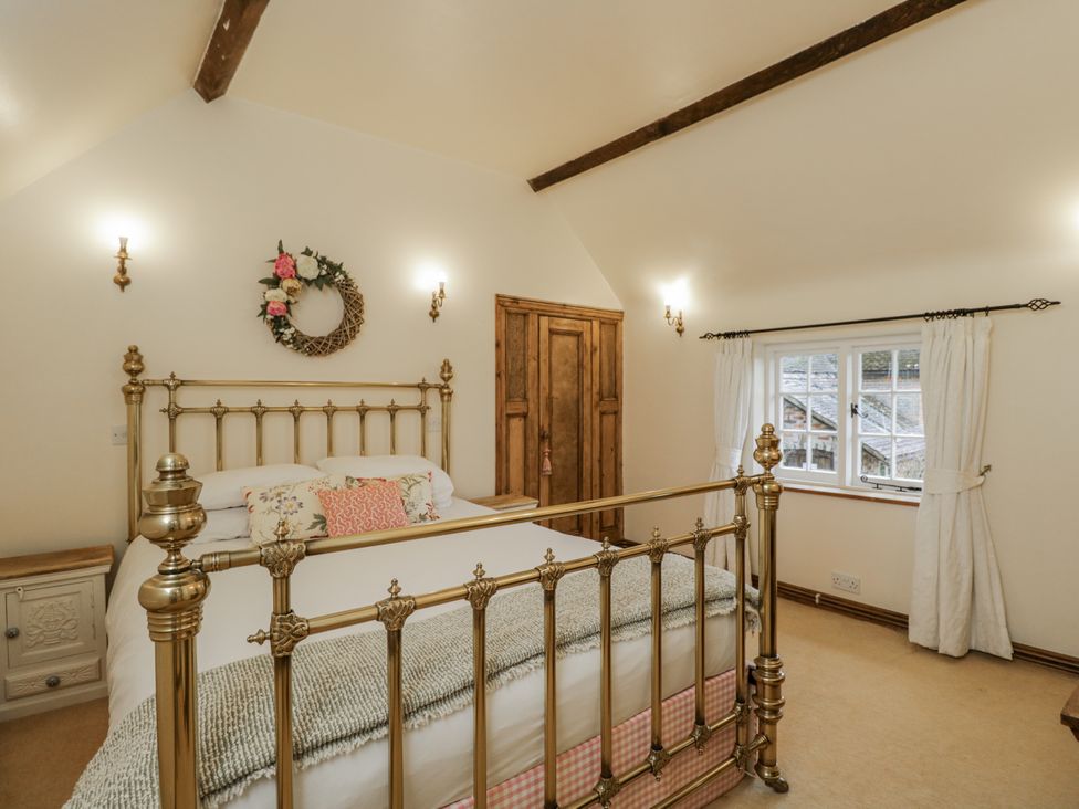 A bedroom with a bed and wardrobe at 24 Eastcourt