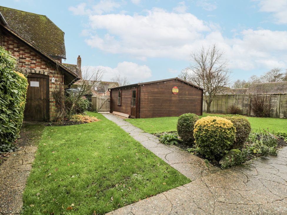 A garden with a shed and pathway at 24 Eastcourt