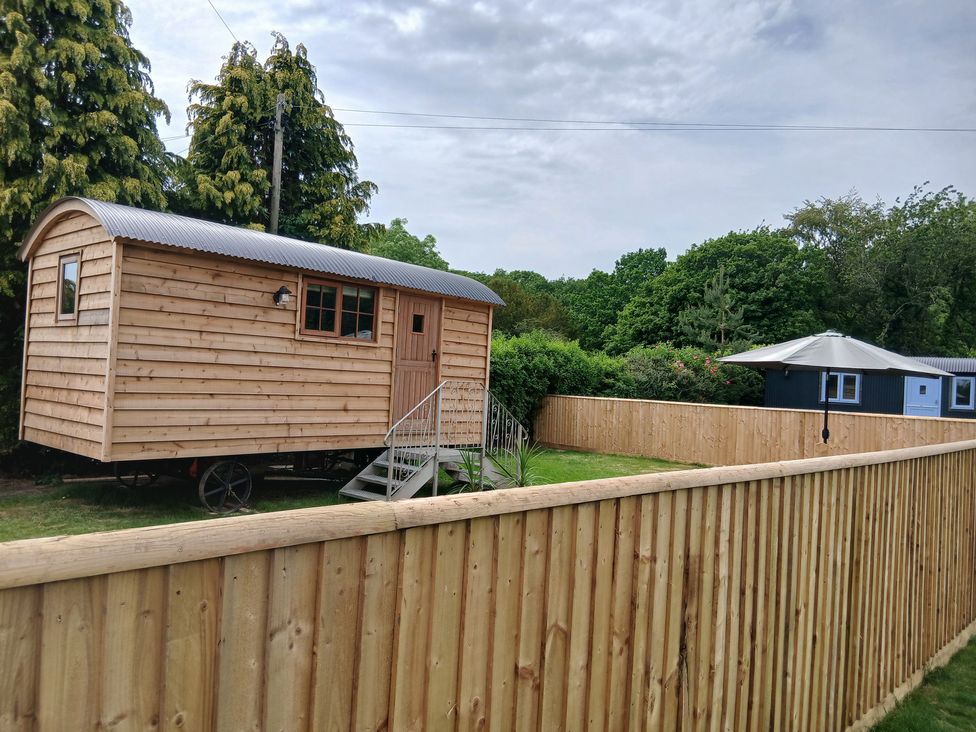 A wooden cabin in a garden at Woodie in Clee Hill