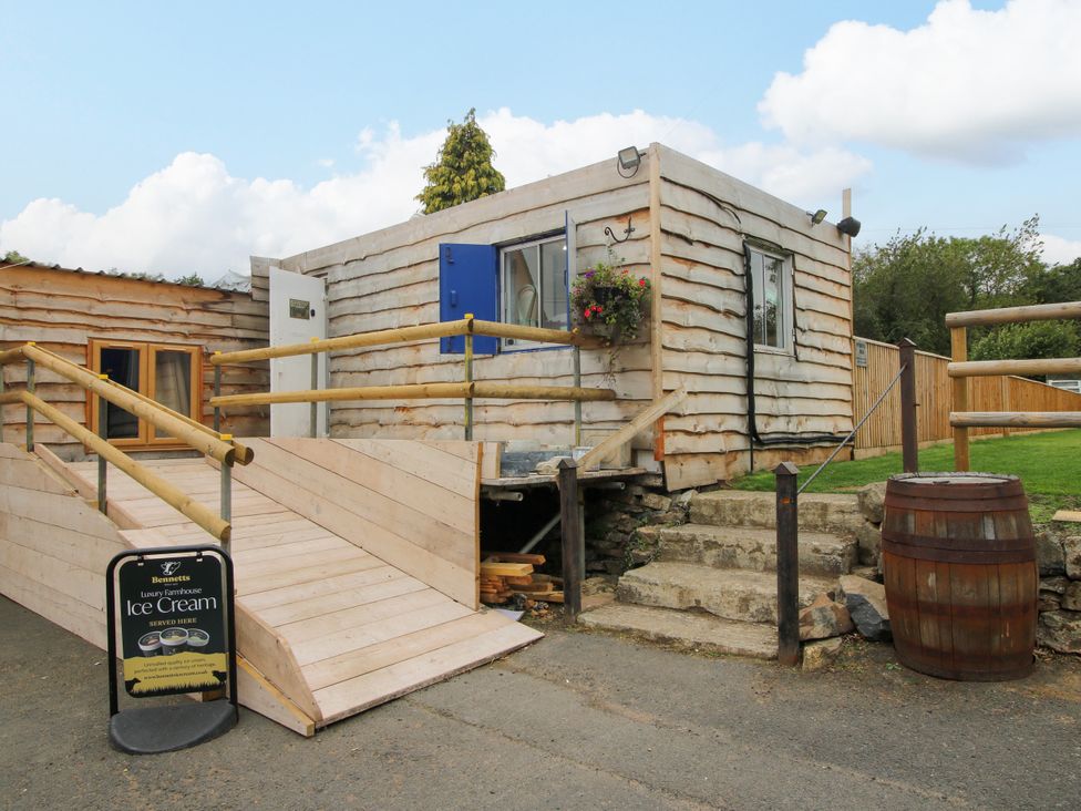 A building with steps and a handrail at Woodie in Clee Hill