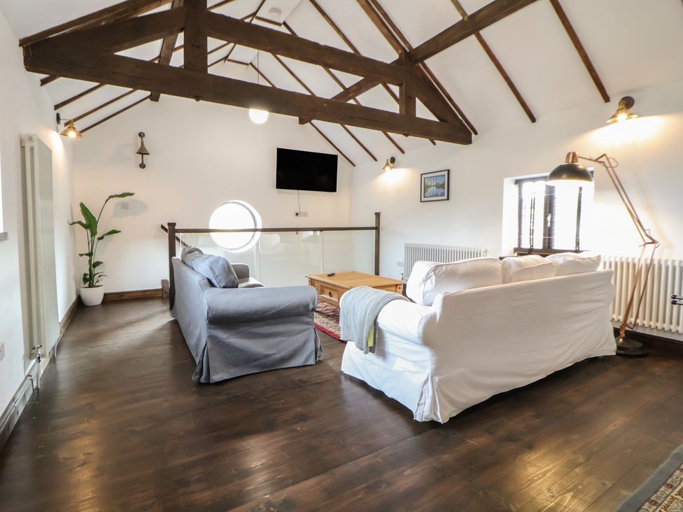 A living room with sofas and a coffee table at Quarry Barn in Wrexham