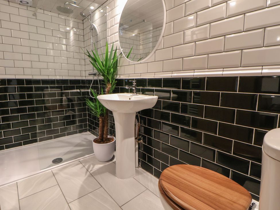 A bathroom with a sink and toilet at Quarry Barn in Wrexham