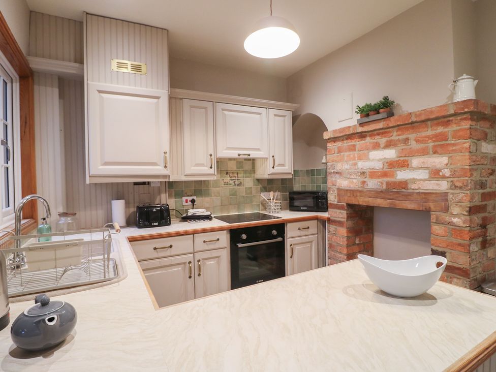 A kitchen featuring a countertop and cabinets at Little Launde Cottage in Launde near Braunston-In-Rutland