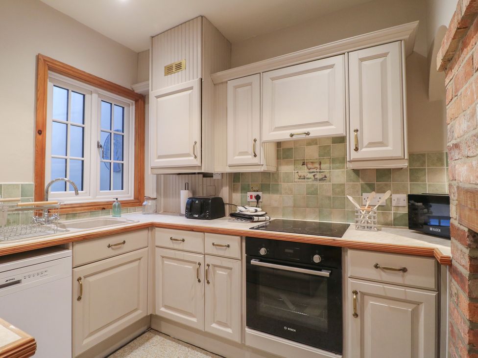 A kitchen with appliances and cabinets at Little Launde Cottage Launde near Braunston-In-Rutland