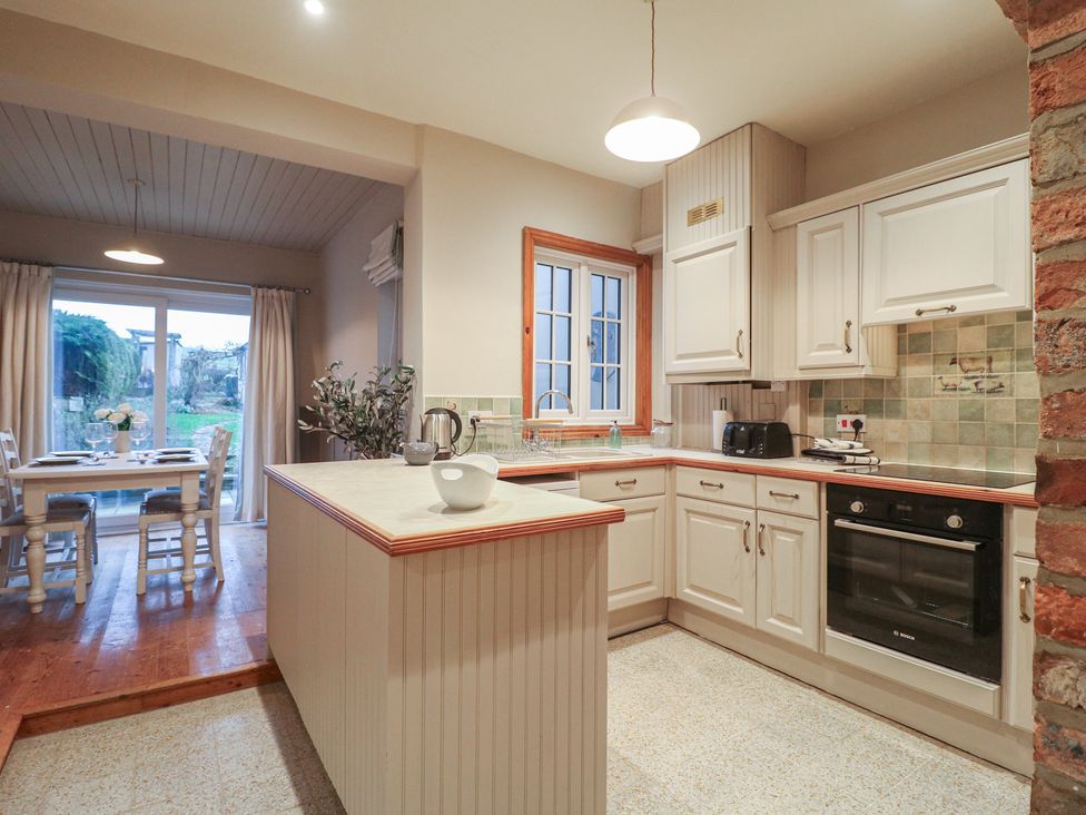 A kitchen with cabinets and a stove at Little Launde Cottage Launde near Braunston-In-Rutland