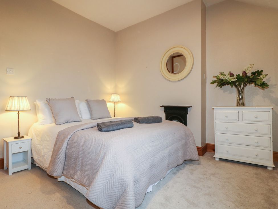 A bedroom with a bed and a dresser at Little Launde Cottage Launde near Braunston-In-Rutland