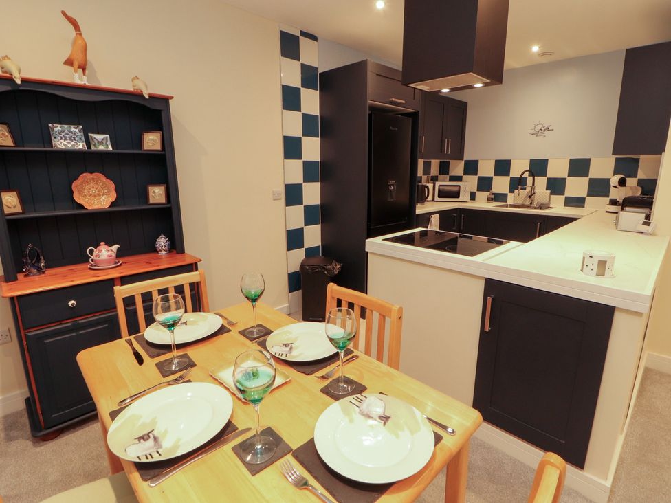 A kitchen with a dining table set at 20 Lorton Street in Cockermouth