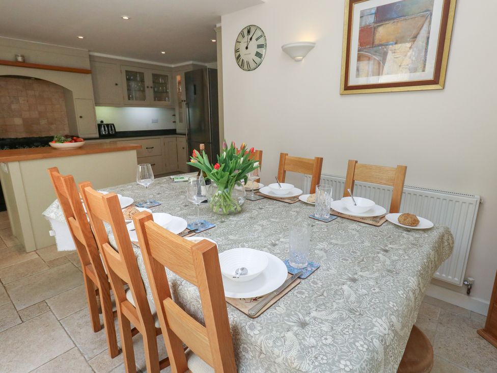 A dining room with a table set for meals at Crantock in 