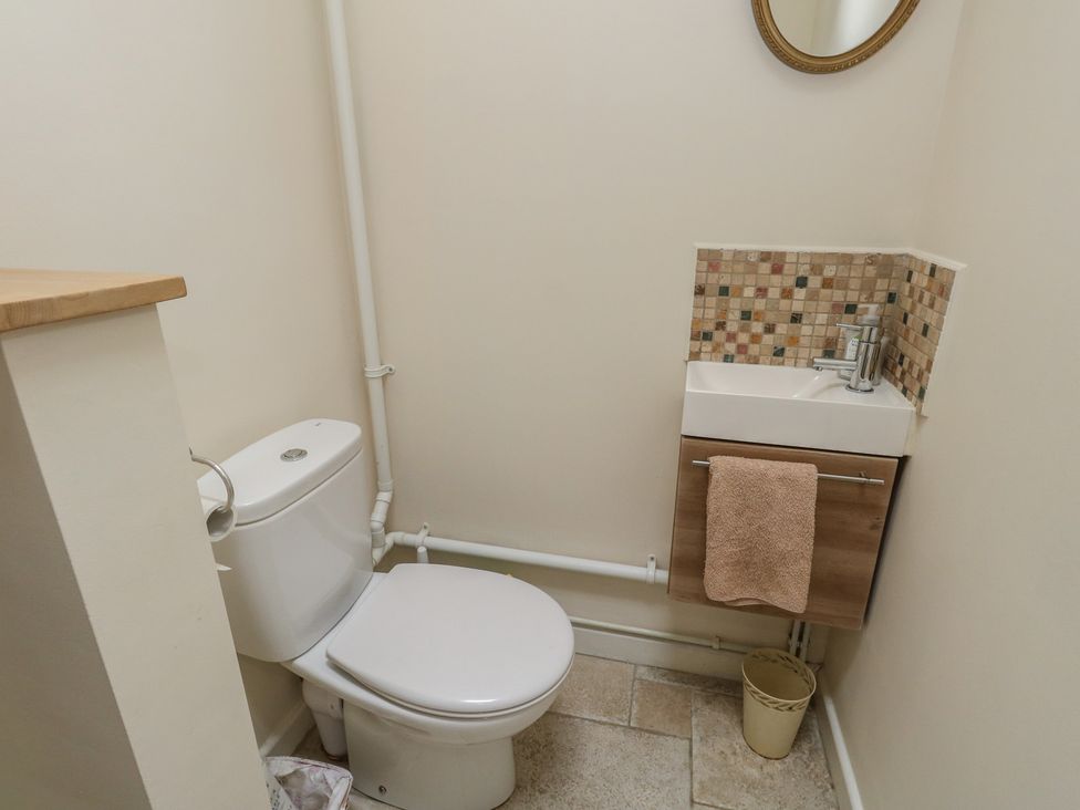 A bathroom with a toilet and a sink at Crantock