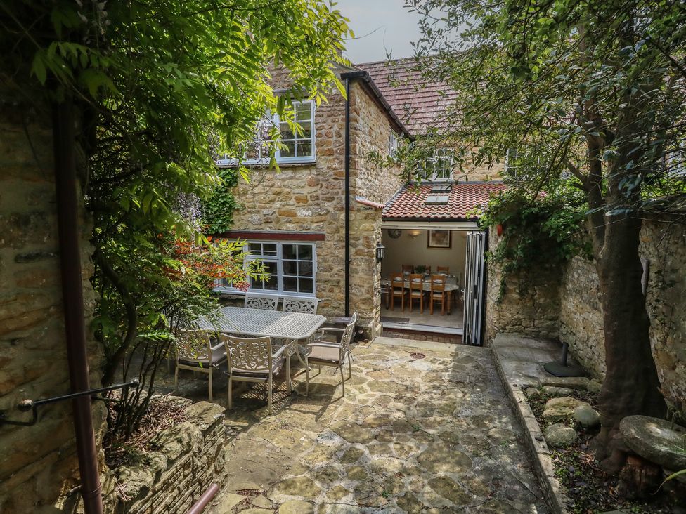 An outdoor dining area with table and chairs at Crantock