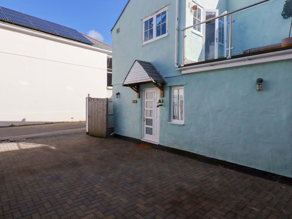 An outdoor area with a door and windows at The Maisonette in Hayle