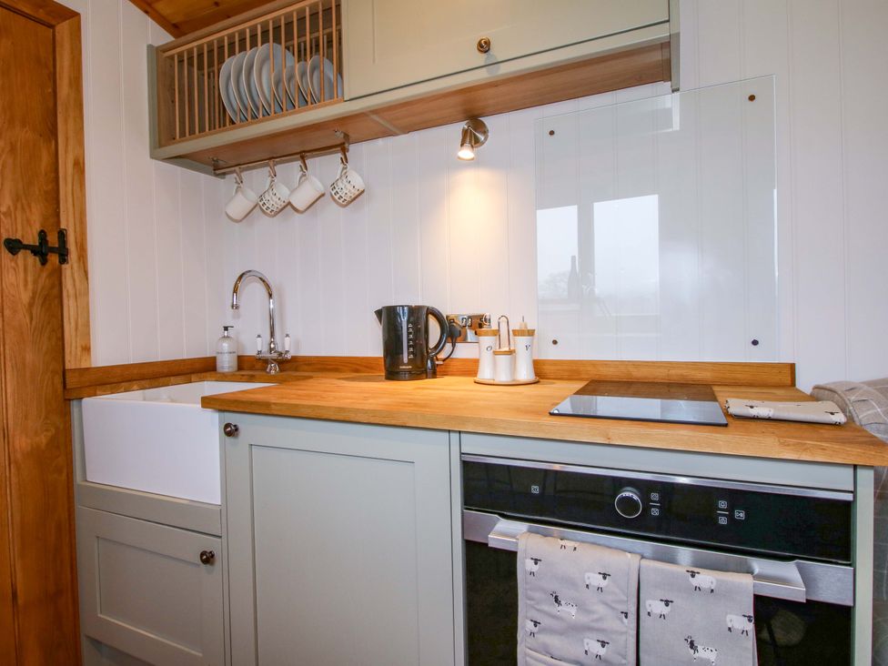 A kitchen with a sink and countertop at Dave’s Place Broadstone near Munslow