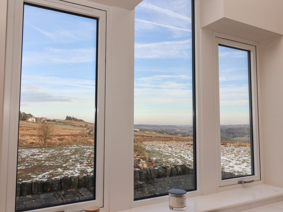 Windows with a view of landscape at Daisy Mount in Keighley