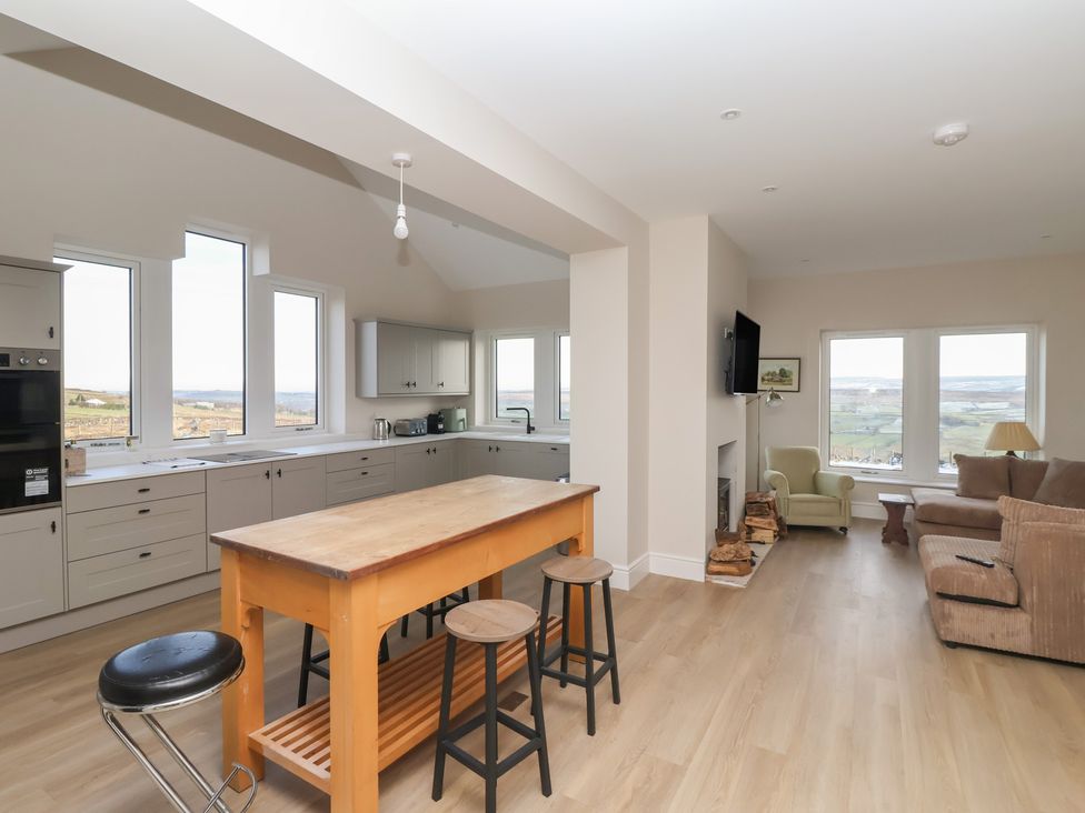 A kitchen with counters and seating at Daisy Mount in Keighley