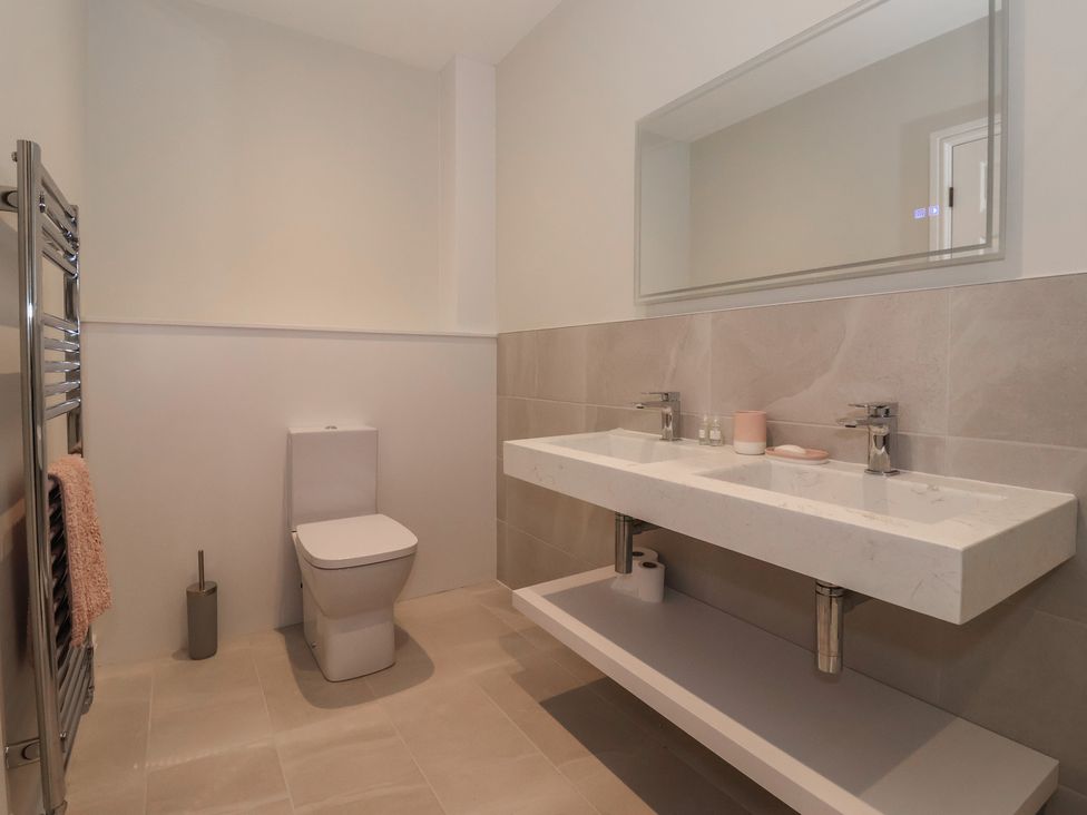 A bathroom with a sink and toilet at Daisy Mount in Keighley