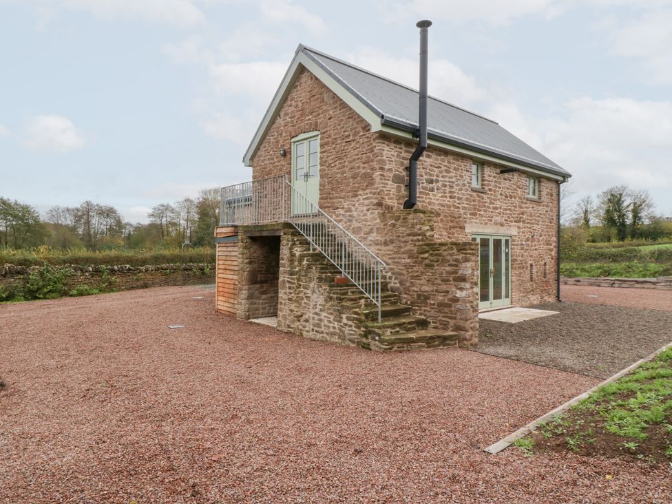 A house with stairs and gravel at Velindra Farm Cottage Hereford