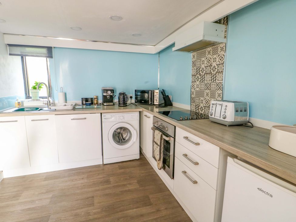 A kitchen with appliances and countertop at The Mill in Holyhead