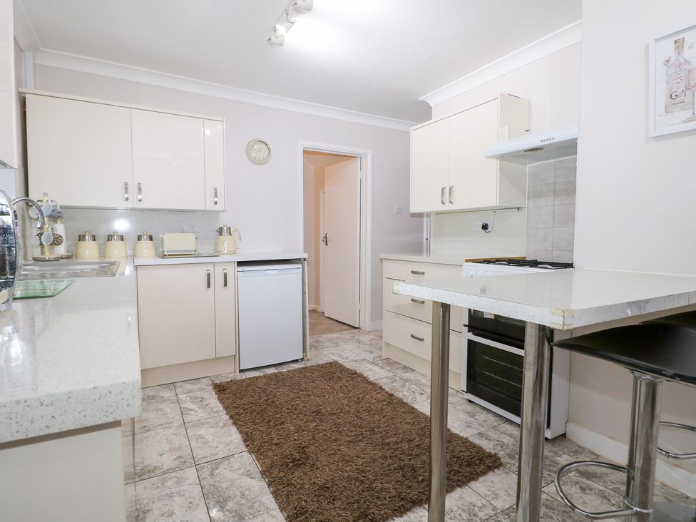 A kitchen with counter, sink, dishwasher, and oven at 24 Dunkirk Close in Romney Marsh